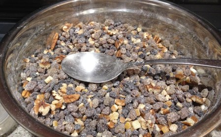 toss fruit and nuts with flour