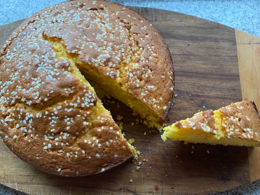 orange cake with one slice cut