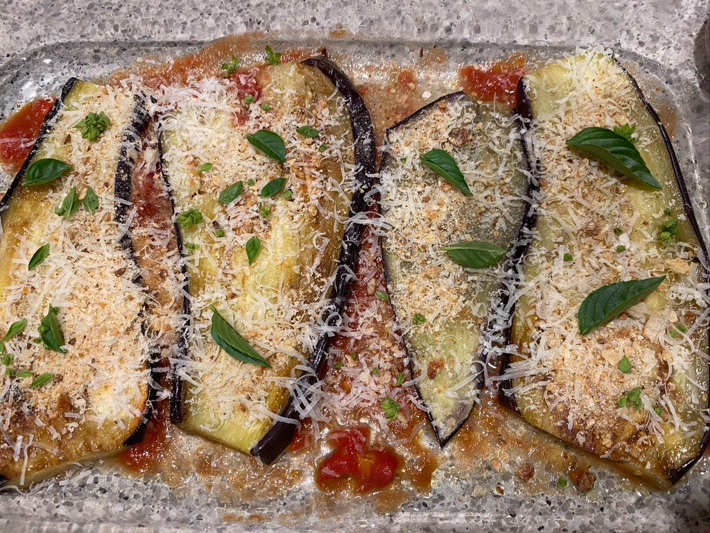top slices with parmesan and basil
