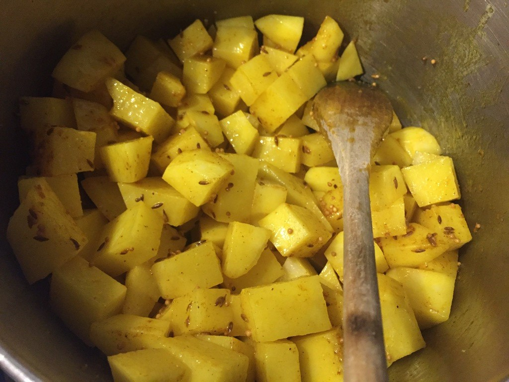 add potato to sauteed spices