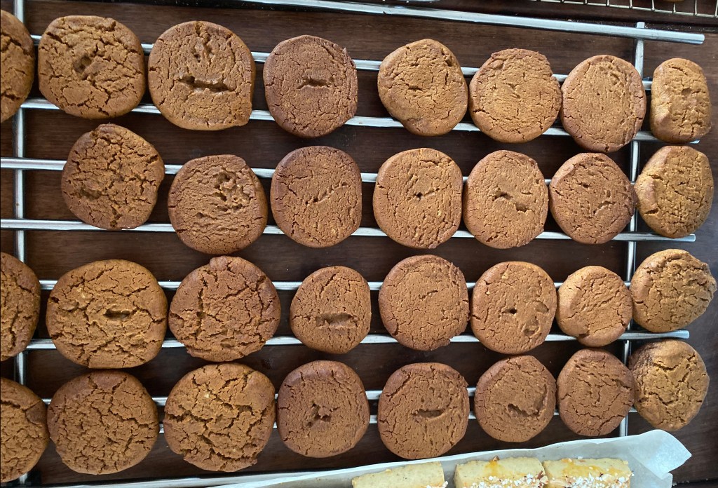 Molasses cookies cooling on a rack