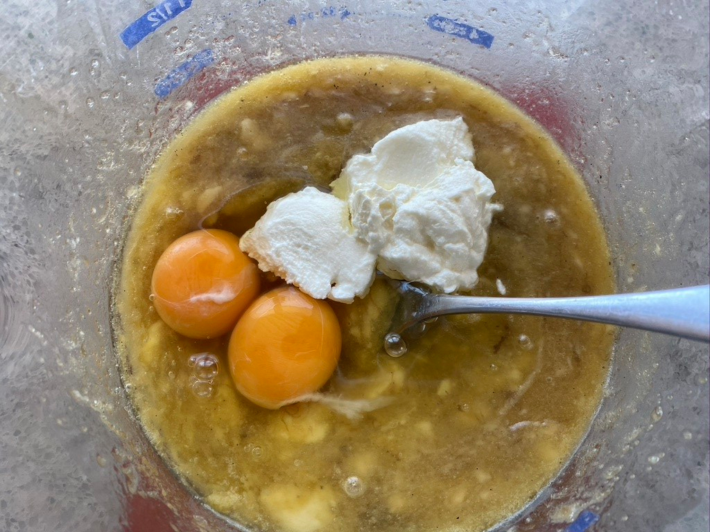 beat eggs and yoghurt into banana mixture