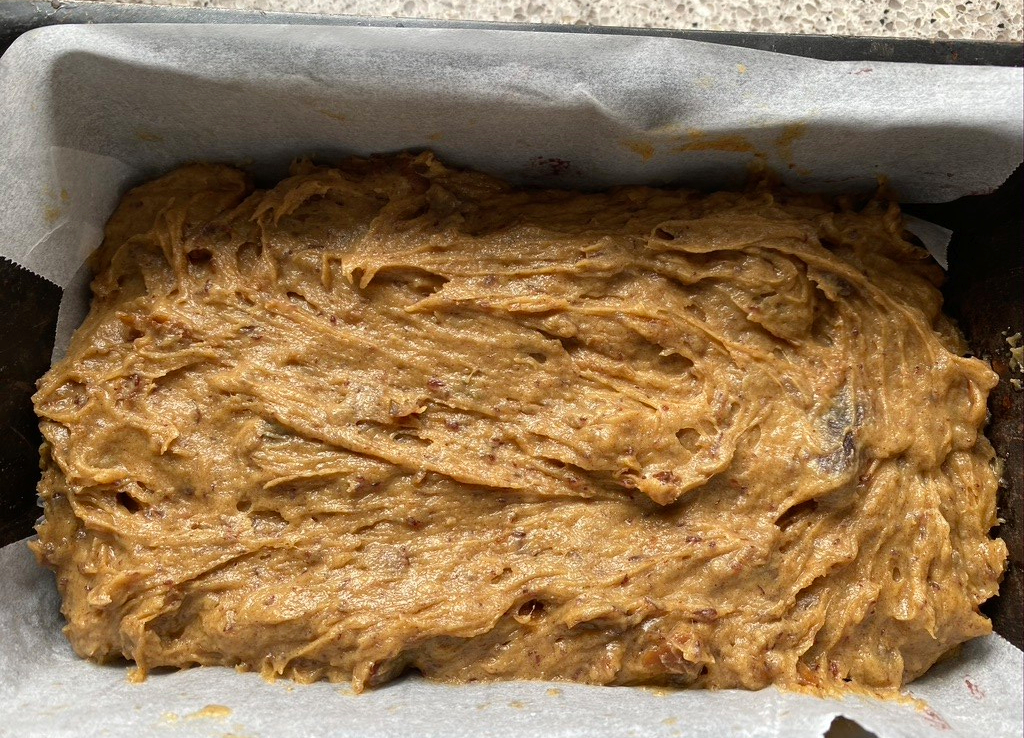 gently spread cake batter over pecans